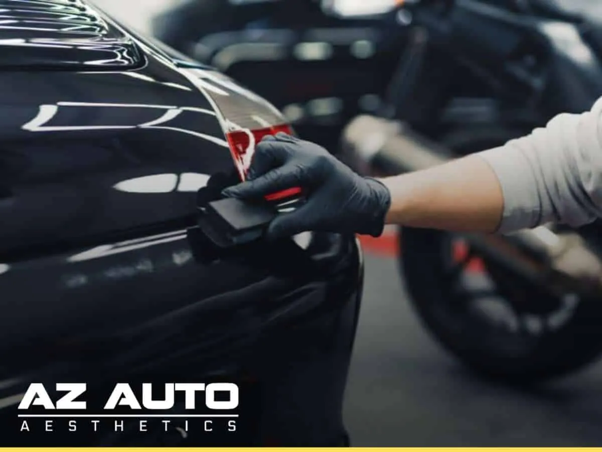 Applying Ceramic Coatings to a car’s surface at AZ Auto Aesthetics.