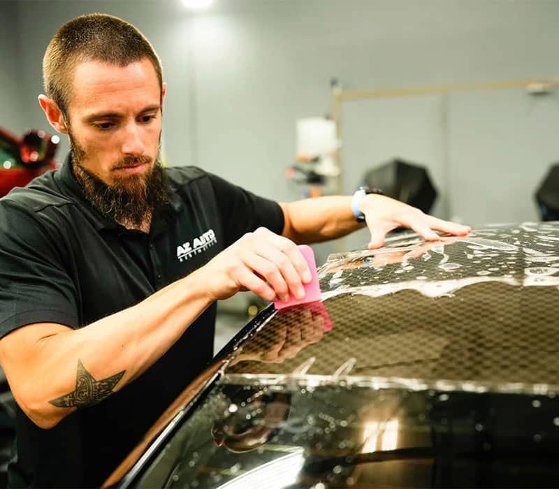 Applying Paint Protection Film On A Car Roof At AZ Auto Aesthetics