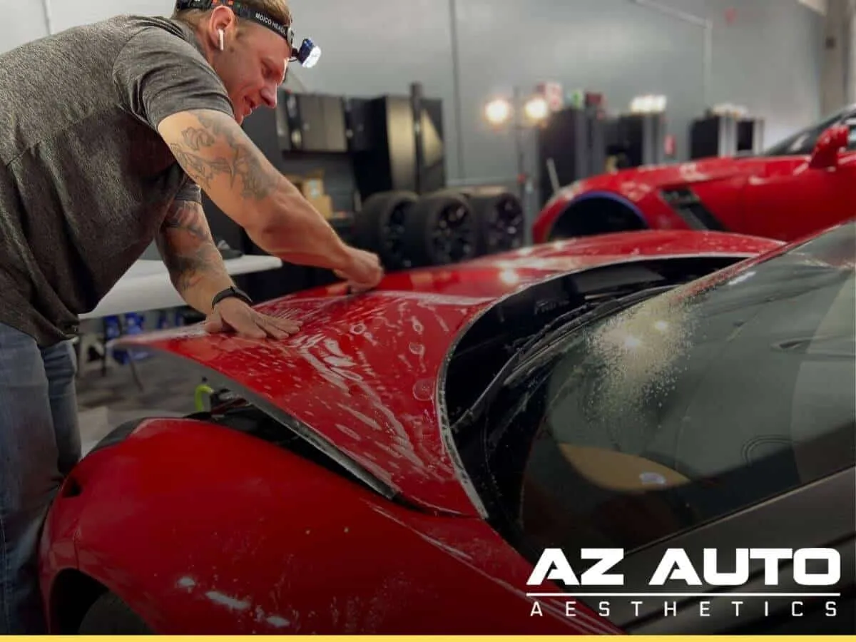 Paint protection film installed on a red car by Mesa Car detailer at AZ Auto Aesthetics