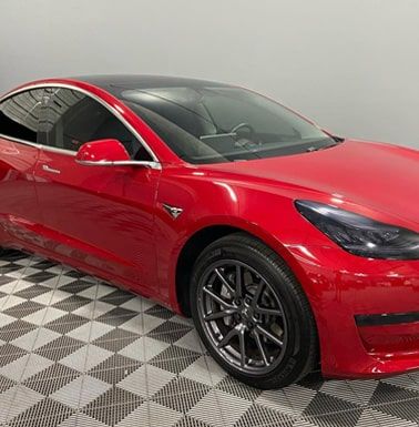 Automotive detailing shop red car alternate front view