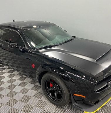 Automotive detailing shop black car alternate front view