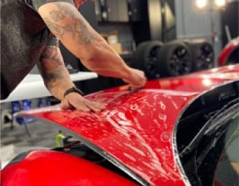 Cost-Effective Paint Protection Film Installation On Red Car Near Tempe
