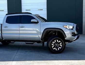 Clear Bra/PPF Installation Specialists On A Toyota Tacoma