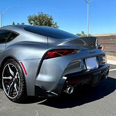 Auto Detailers Providing Paint Correction And Vinyl Wrap On A Toyota Supra