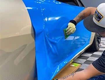 Man Cleaning Vinyl And Leather Car Seat, Carpet And Upholstery By Hand